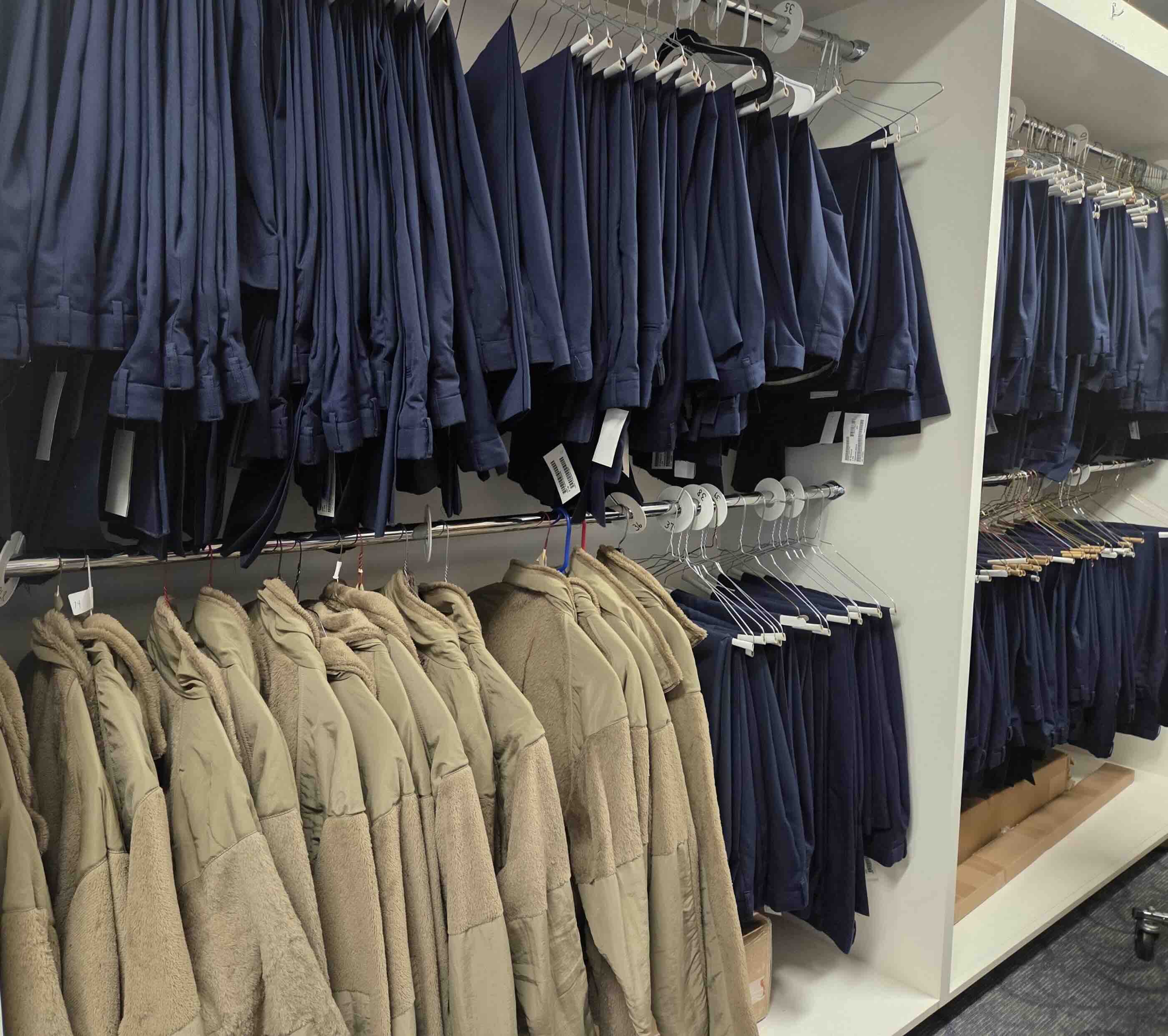 ROTC dress uniforms hanging up in racks